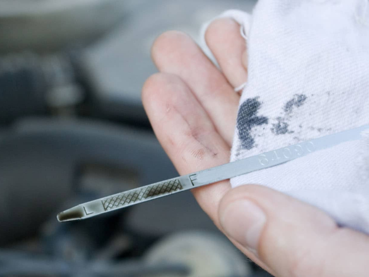 Checking oil level on dipstick