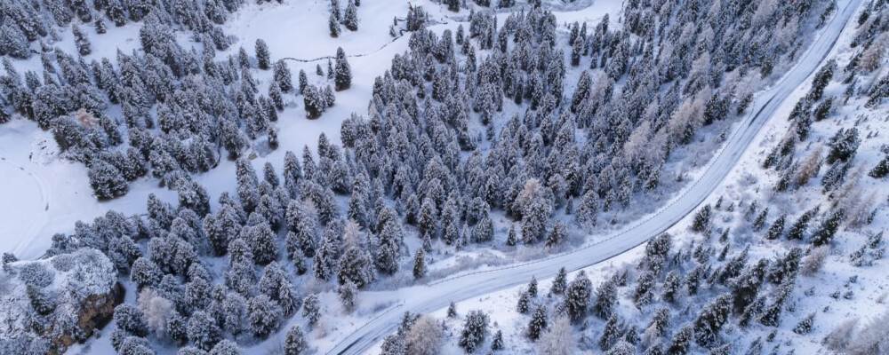 snowy road in winter aerial view
