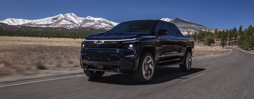 2025 Chevrolet Silverado EV driving in mountains
