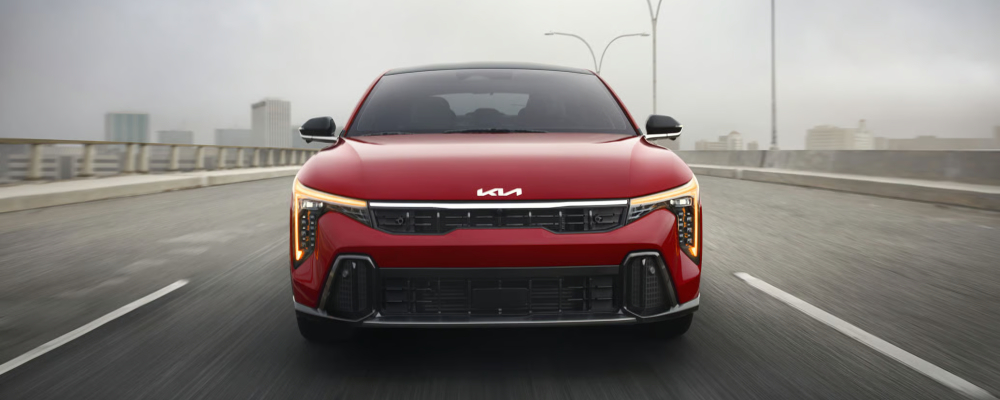 2026 Kia K4 GT-Line Turbo in Currant Red Color with Amber Daytime Running Lights and Cube Projector Headlights