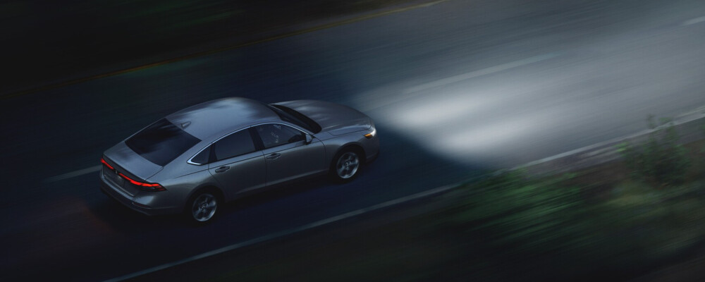 2025 Honda Accord Hybrid driving on night road