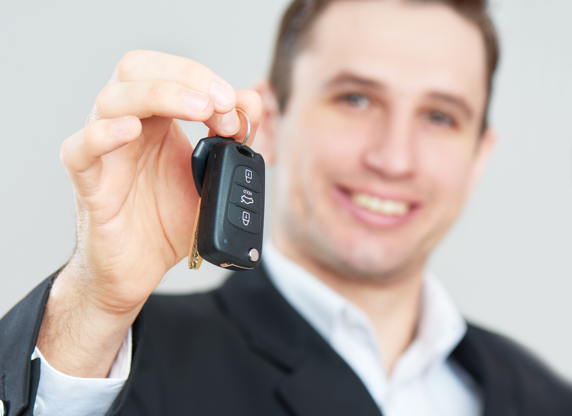 Man holding out keys