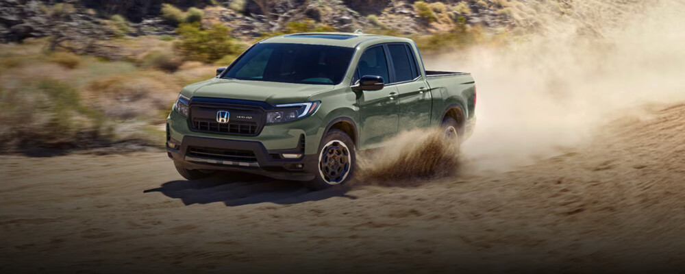 ash green 2026 Honda Ridgeline drives through dessert