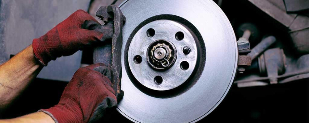 Brake Mechanic Adjusting Brake Pad