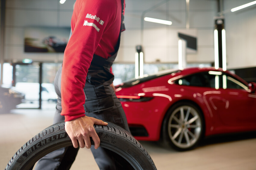 Porsche Mechanic with Porsche Tire