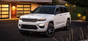 2024 Jeep Grand Cherokee parked in front of building at night