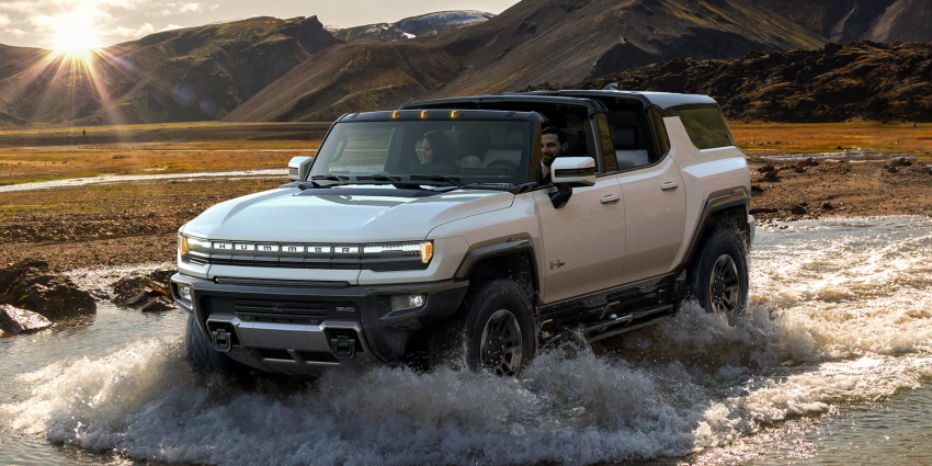 2024 GMC Hummer EV SUV driving through water