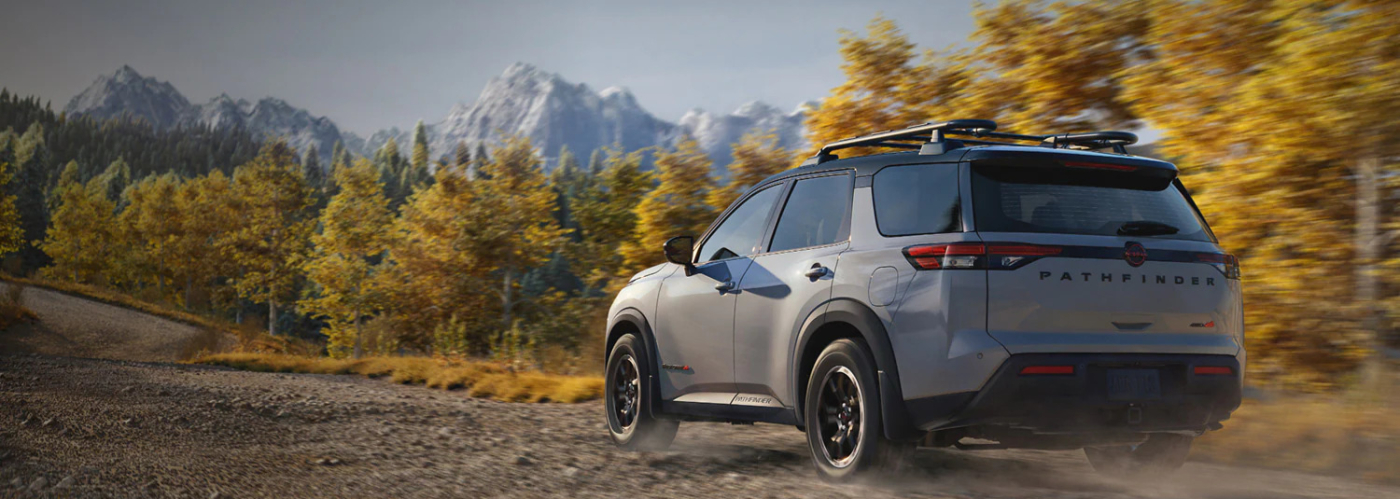 2026 Nissan Pathfinder driving down a dirt road