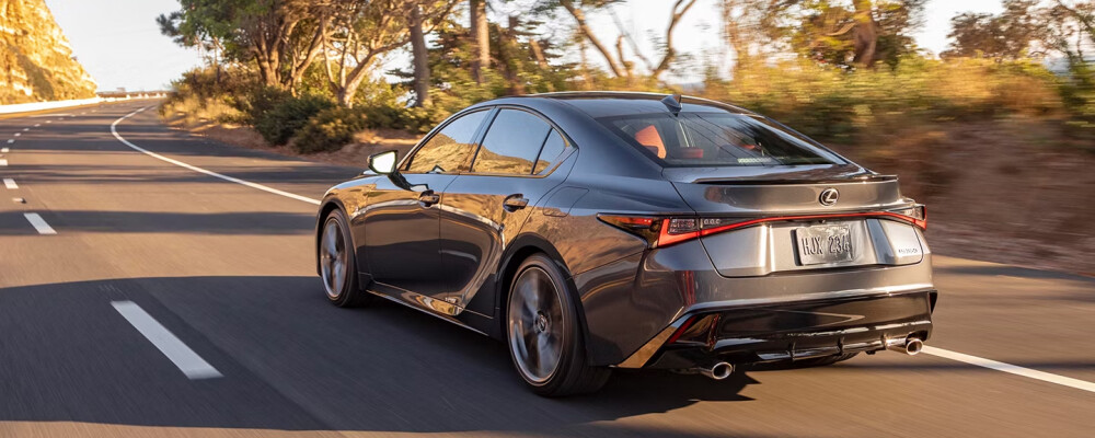 2025 Lexus IS driving down road