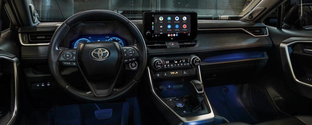2025 Toyota RAV4 Hybrid XSE interior shown in Black/Blue SofTex® trim with Advanced Technology Package and 11-speaker JBL®