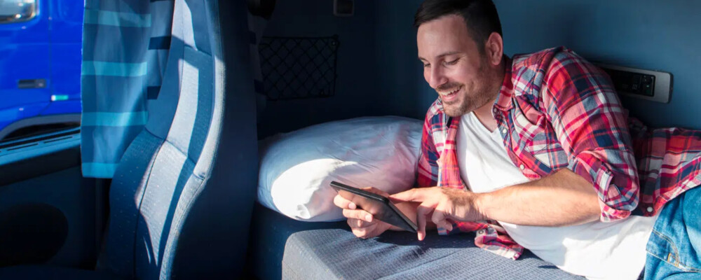 Semi-Truck Driver on Electronic Device