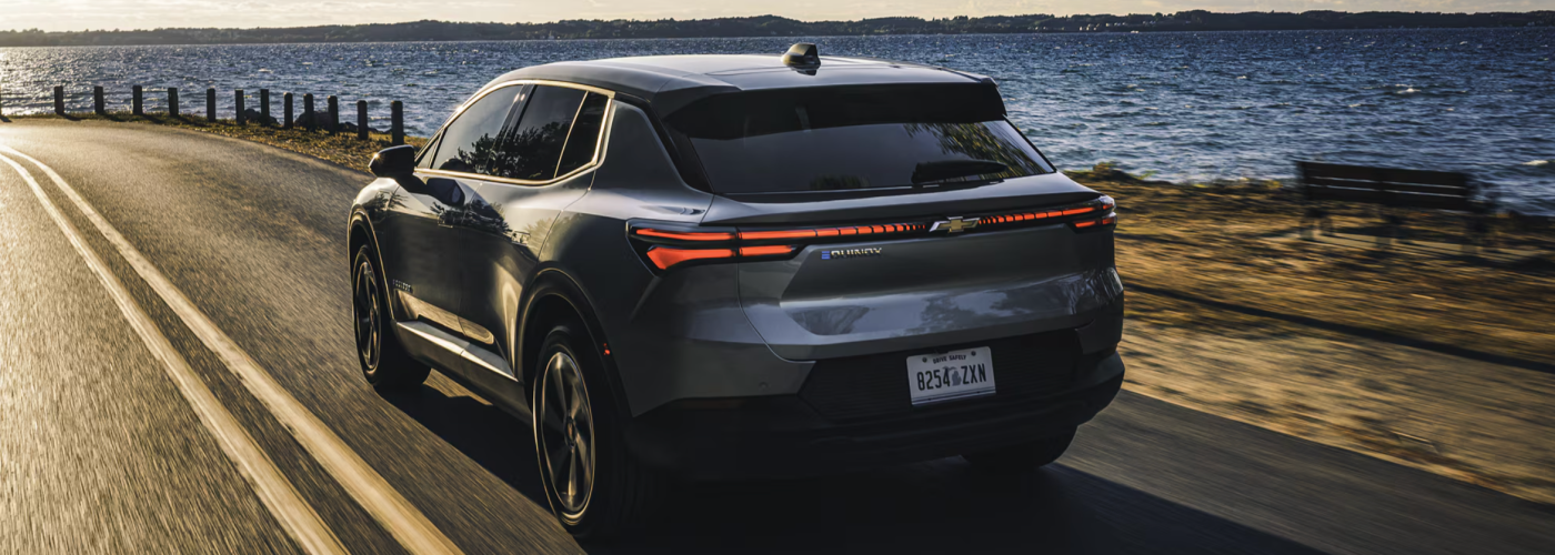 2026 Chevy Equinox driving next to a lake