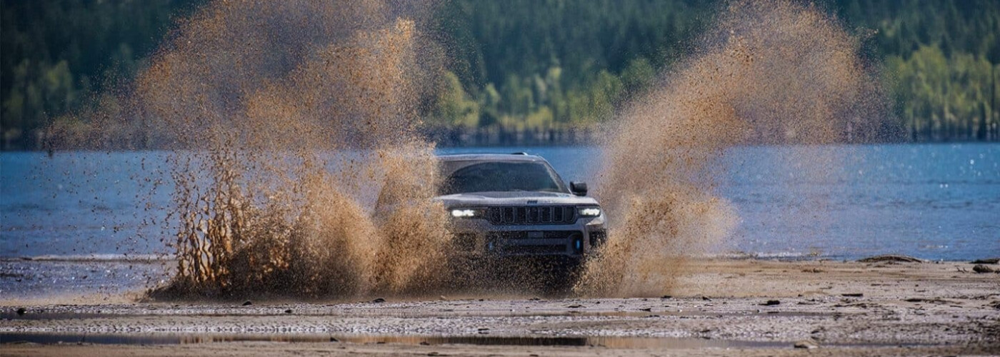 2025 Jeep Grand Cherokee driving through muddy water 2025 Jeep Grand Cherokee driving through muddy water