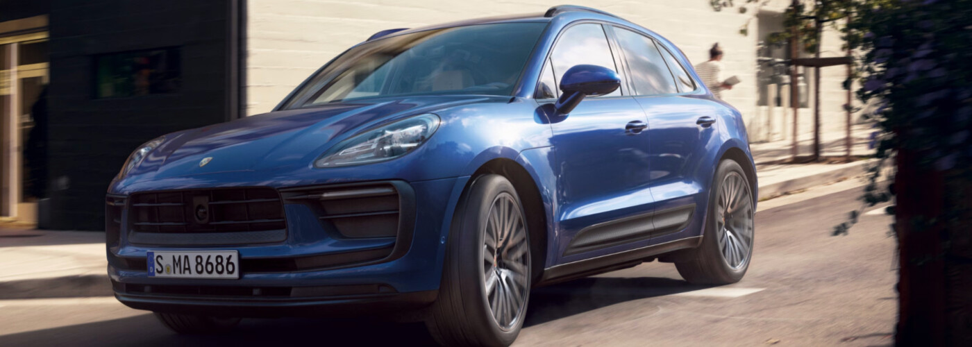 2026 Porsche Macan blue driving on road