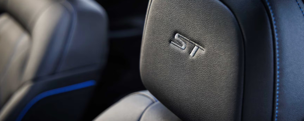 The black leather seats are stitched in royal blue.