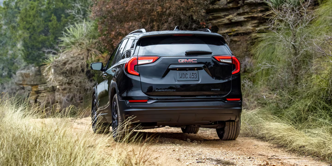 2024 GMC Terrain driving on forested path
