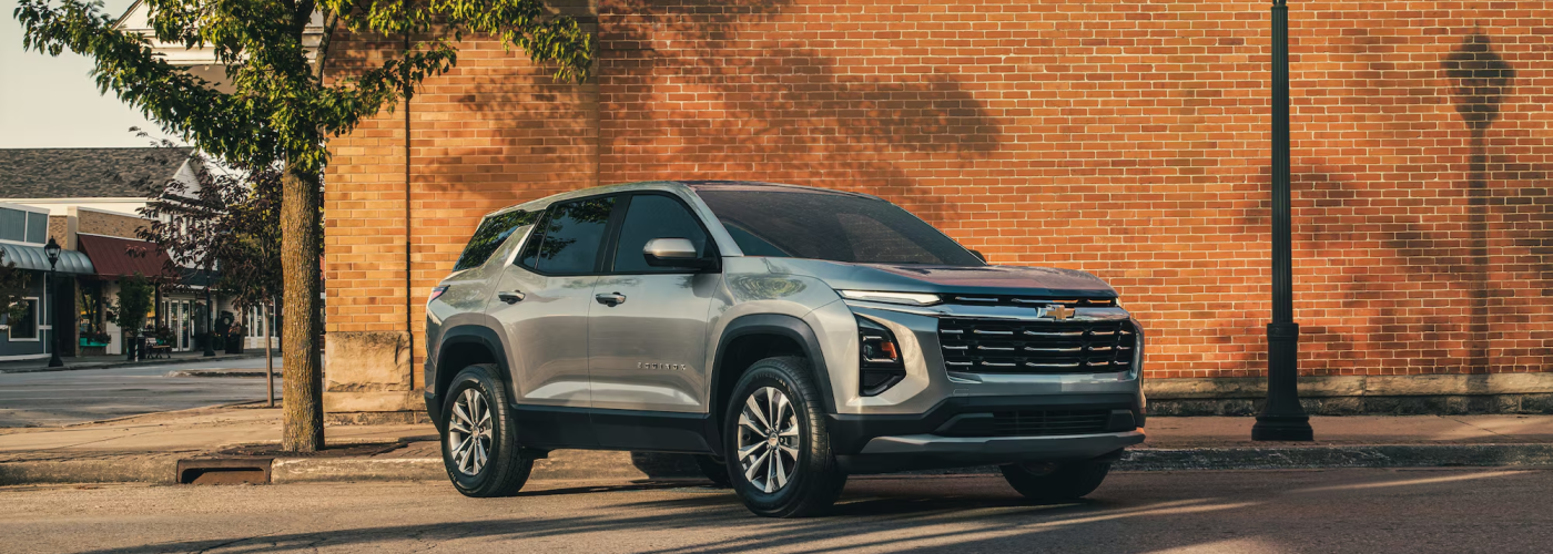 2026 Chevy Equinox parked in rustic downtown area