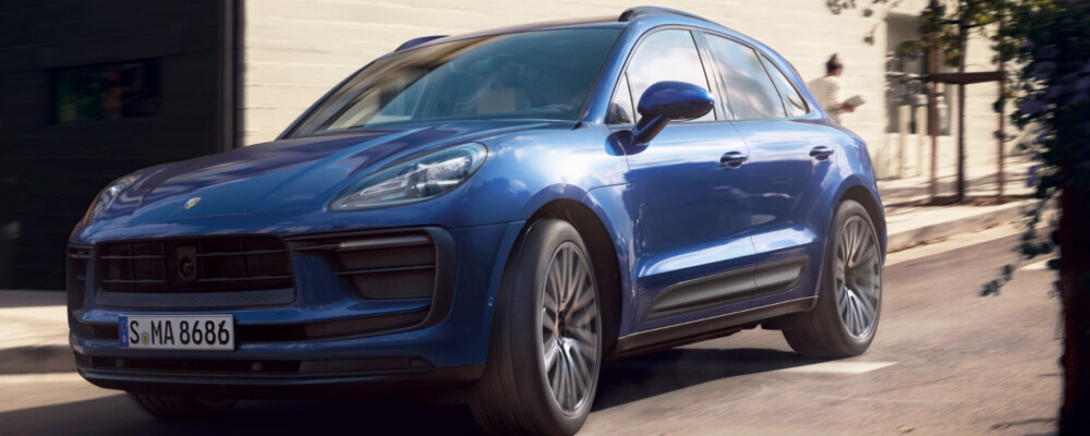 2026 Porsche Macan blue driving on road