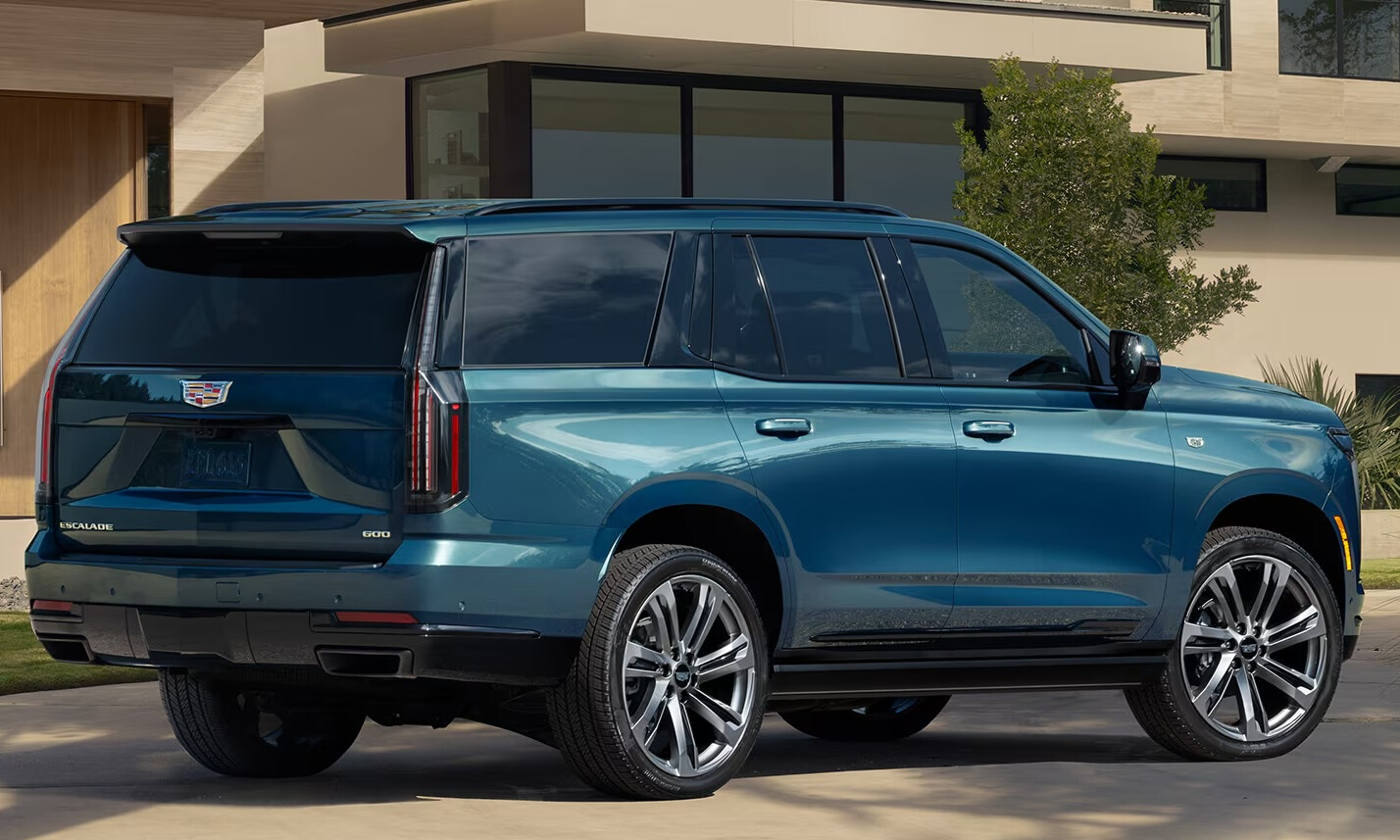 Blue 2026 Cadillac ESCALADE parked in front of house
