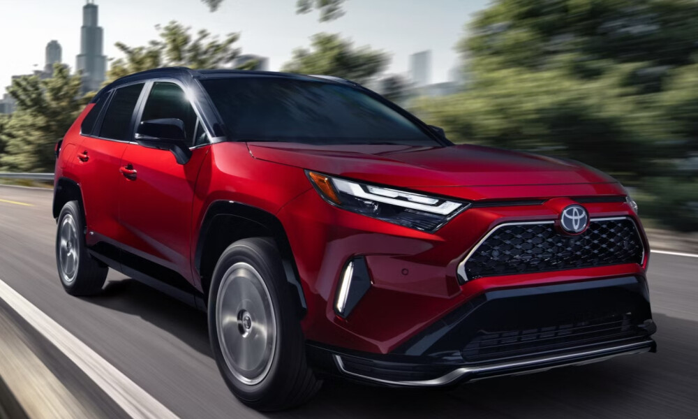 2026 Red Toyota RAV4 hybrid driving fast