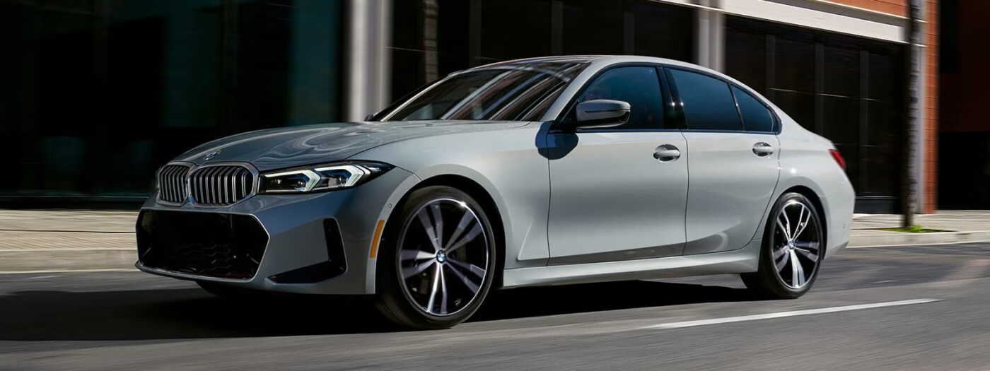 2023 BMW 3 Series sedan driving on road