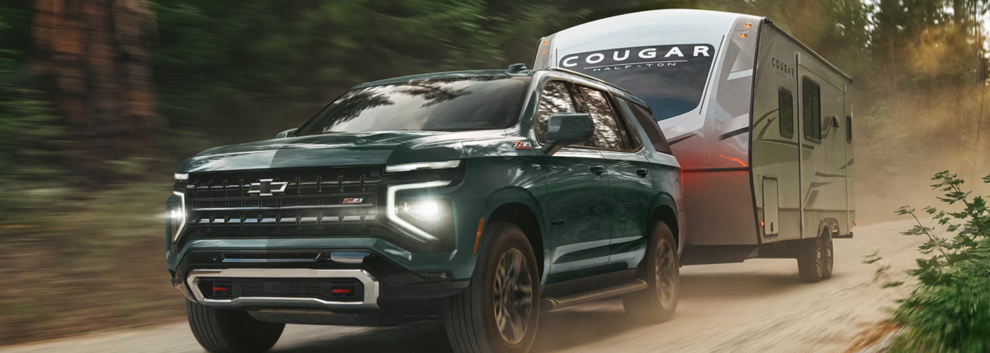 2026 Chevy Tahoe towing a camping trailer
