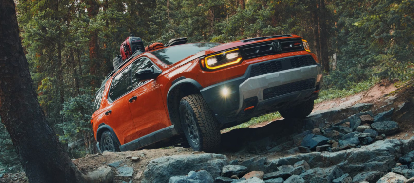 Orange 2026 Honda Passport in Forest