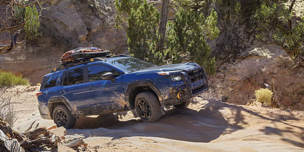 2026 Subaru Outback Wilderness outside driving through dirt