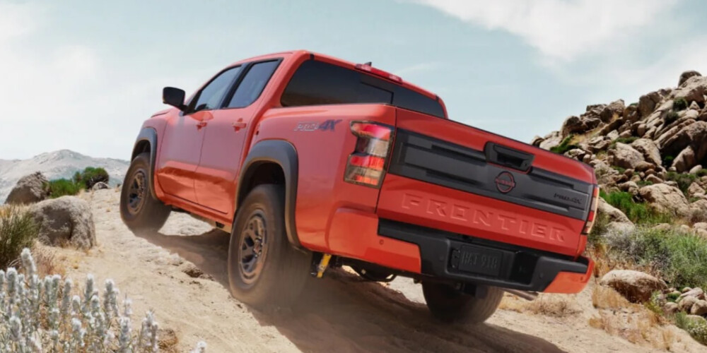 2026 Nissan Frontier 2026 Orange Nissan Frontier climbing hill