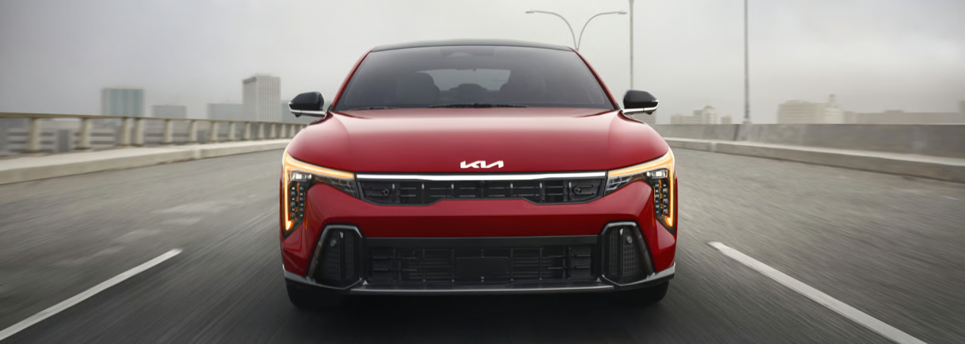 2026 Kia K4 GT-Line Turbo in Currant Red Color with Amber Daytime Running Lights and Cube Projector Headlights