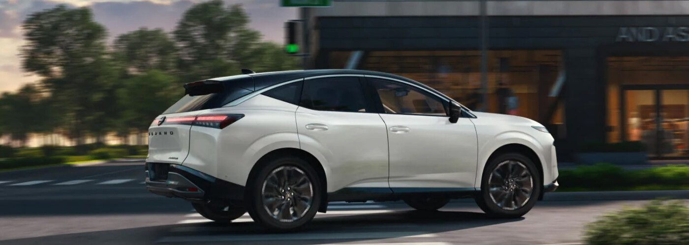 2025 Nissan Murano White Nissan Murano driving on city street