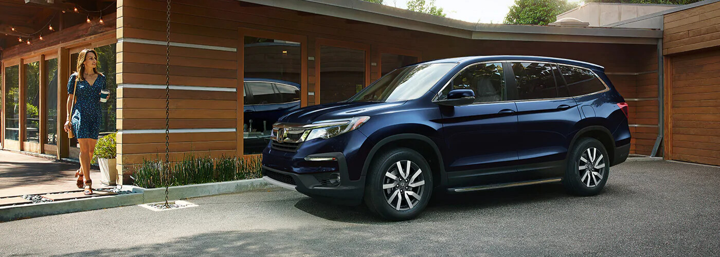 2021 Honda Pilot parked outside of a house 2021 Honda Pilot parked outside of a house