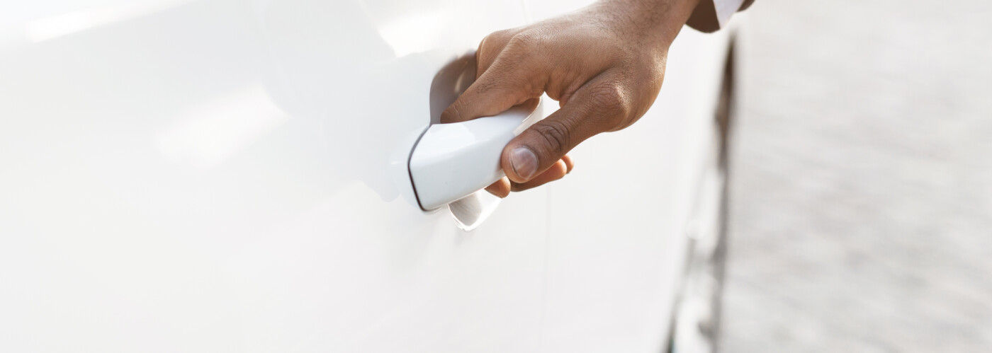 Man holding car door handle Man holding car door handle