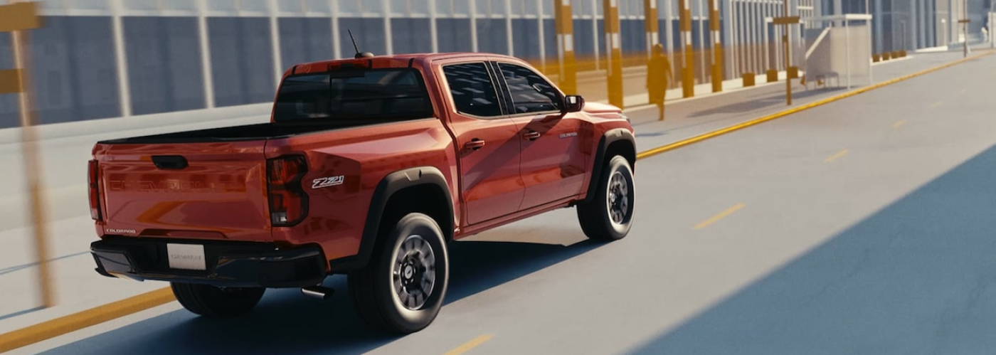 Rust colored 2026 Chevrolet Colorado driving down street