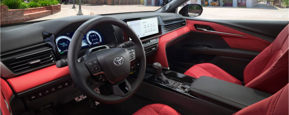 Red and black interior of a 2025 Toyota Camry