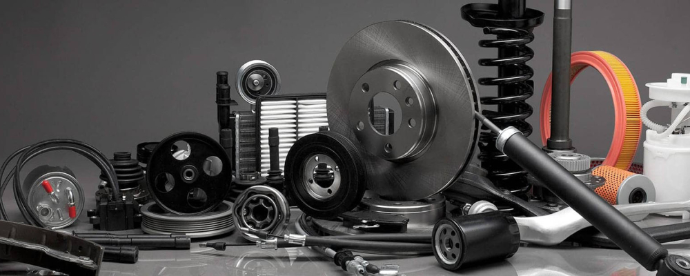 An assortment of Automotive parts on a dark background