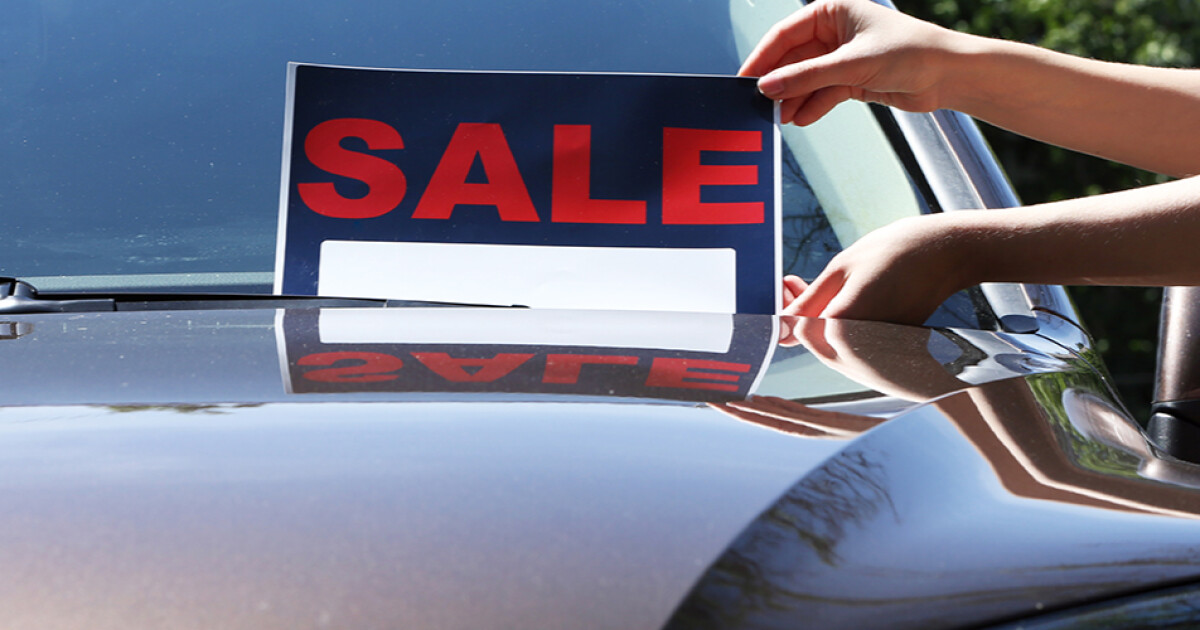 car for sale sign on a used vehicle car for sale sign on a used vehicle