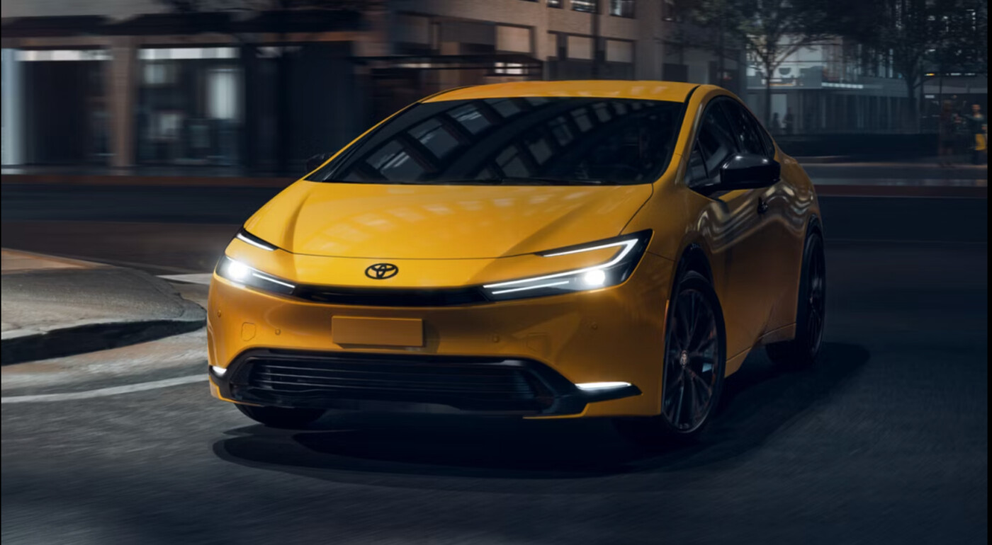 2026 Toyota Prius driving on city street at night
