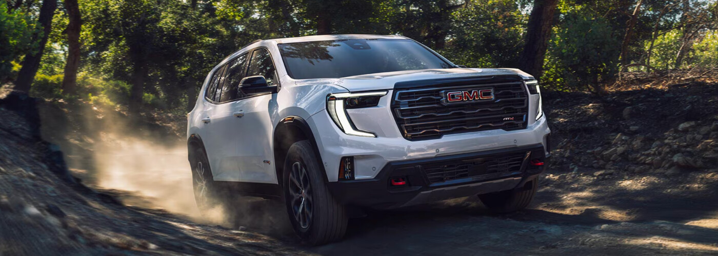 2026 GMC Acadia white exterior off-roading