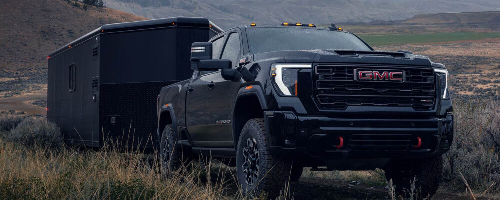2026 GMC Sierra 2500 HD towing in grass