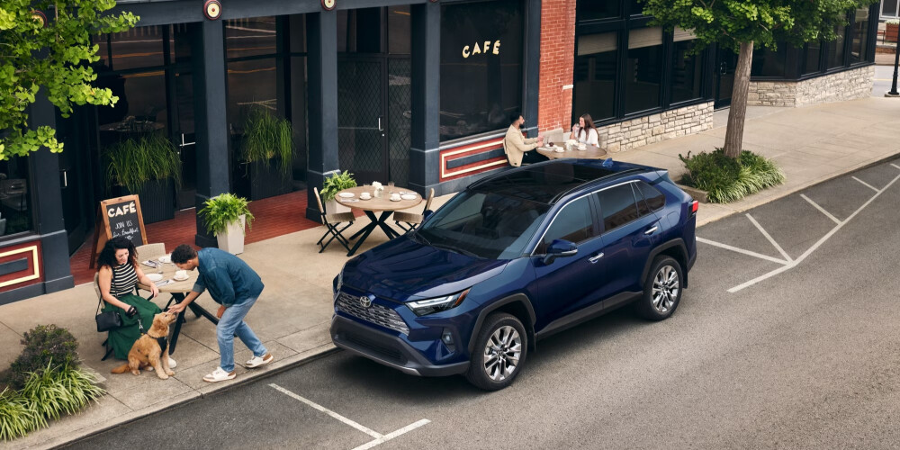 2026 Blue Toyota RAV4 parked on city block