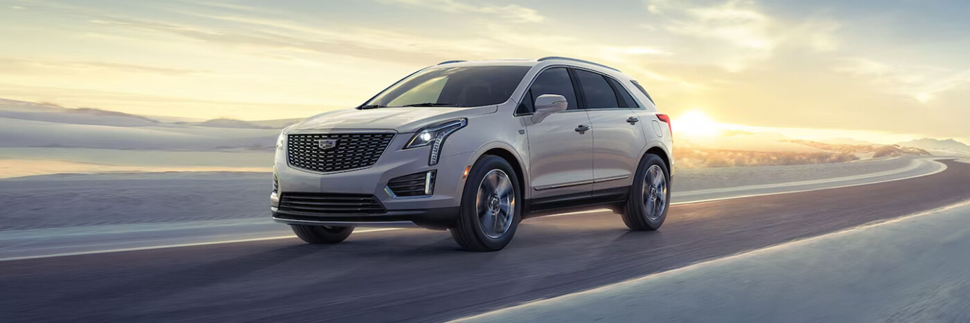 2024 Cadillac XT5 driving during sunrise