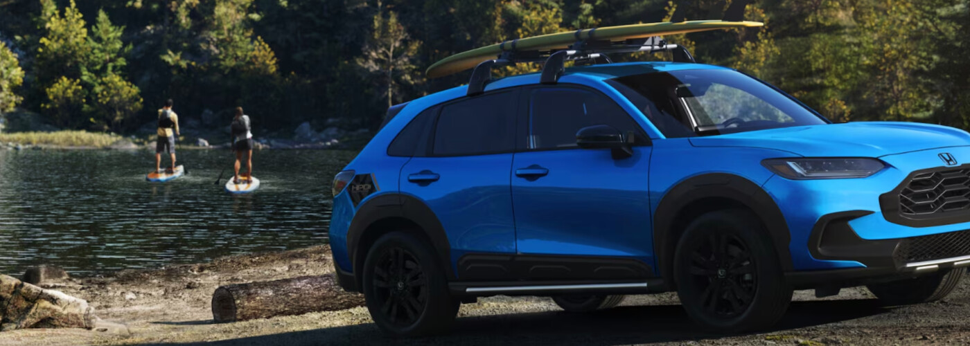 Blue Honda CR-V parked near lake