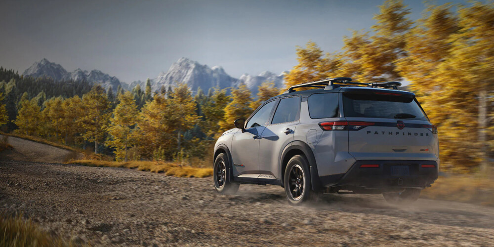 2026 Nissan Pathfinder driving down a dirt road