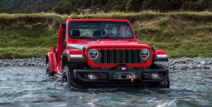 2024 Jeep Wrangler driving through a river