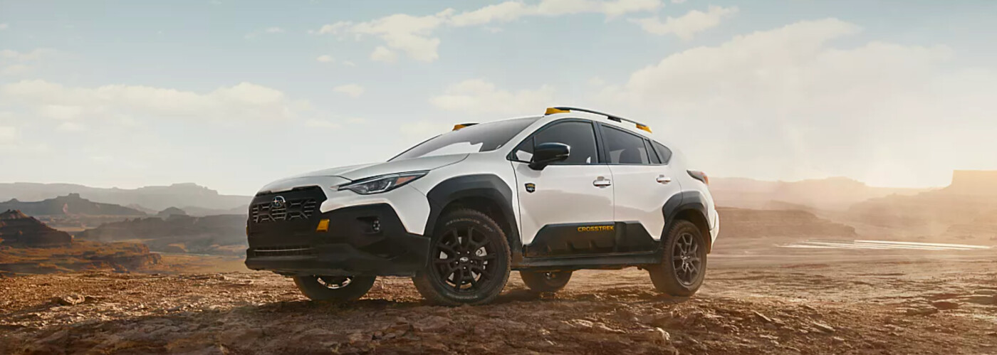 2026 Subaru Crosstrek outside parked on dirt with sunset 