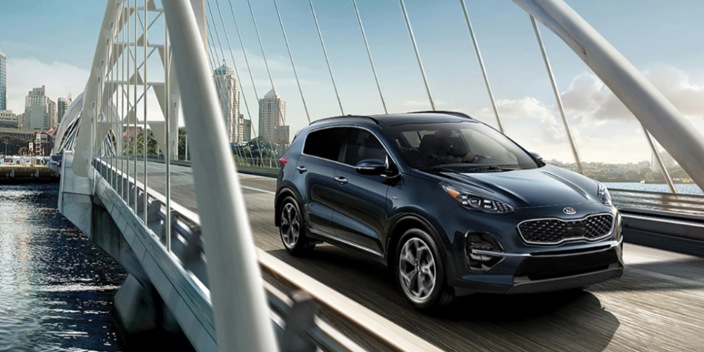 2022 Kia Sportage driving on bridge
