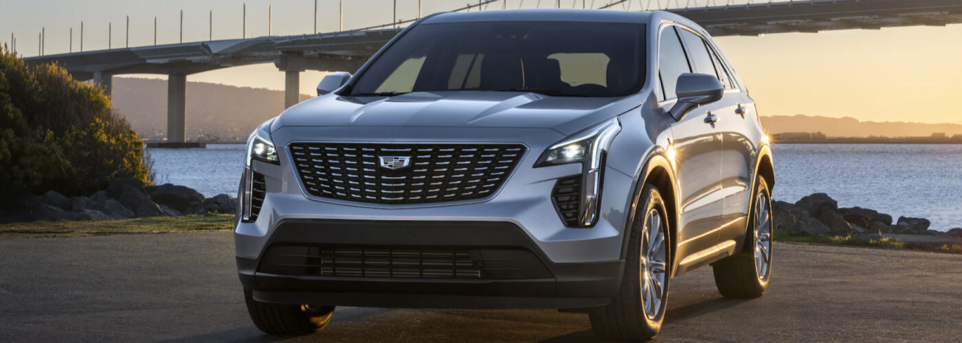 2021 Cadillac XT4 in front of bridge water